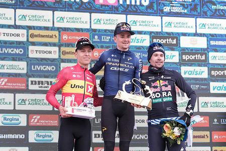 (L-R) Tobias Halland Johannessen (Norway) of Uno-X Mobility (2nd place), Thomas Pidcock (Great Britain) of Pinarello Q36.5 (1st place) and Primož Roglič (Slovenia) of Red Bull - BORA - hansgrohe (3rd place) celebrate on the podium during the 107th edition of the Milano-Torino, celebrating the 150th anniversary of the race at Basilica di Superga.