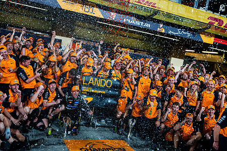 McLaren Formula 1 Team's English driver Lando Norris's team celebrates after winning the world championship at the Formula 1 Abu Dhabi Grand Prix 2025.