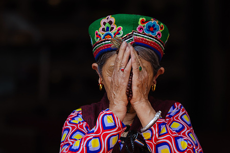 A Buddhist devotee offers prayers during the Buddha Jayanti festival at Boudha Stupa UNESCO world heritage site. Buddha Jayanti is a significant day for both Hindus and Buddhists in Nepal, marking the birth, enlightenment, and Mahaparinirvana (death) of Lord Buddha.