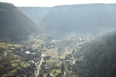 The medieval village of Baume-les-Messieurs in Jura, is seen on a winter morning. It is located at the bottom of a cirque, surrounded by cliffs about a hundred meters high. It was awarded the label: "The Most Beautiful Villages of France"