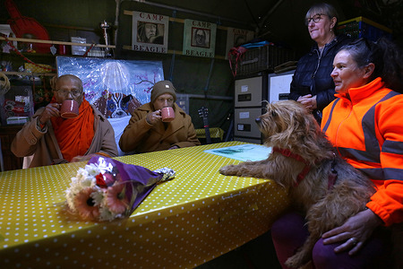 Chief priests Vimala Thero from Letchworth temple (L) and Palitha Thero from Cambridge temple enjoy a cup of tea at Camp Beagle before blessing those going on the walk. Activists from Camp Beagle start their 66 mile walk from Camp Beagle to Parliament Square in London on World Day for Animals in Laboratories. They intend to arrive on Monday 27th April in time for the Parliamentary petition debate calling for 'an end to testing on dogs and other animals for development of products for human use' .The walk aims to raise awareness about the beagles being bred at MBR Acres for toxicology testing.