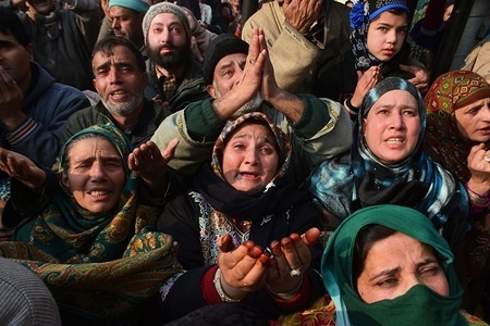 Kashmiri Muslims pray as a priest (not pictured) displays the holy relic believed to be of Sufi Saint outside the Dastgeer Sahib shrine on the occasion of annual Urs (birth anniversary) of 11th century Sufi preacher Sheikh Abdul Qadir Jeelani on December 30, 2017 in Srinagar,Indian Administered Kashmir. Thousands of Kashmiri Sufi Muslims gathered on Sunday at the shrine of Jeelani, also known as Shah-e-Baghdad (King of Baghdad), The shrine is named Dastegeer Sahib after the reverential title of Jeelani , who although never visited Kashmir is held in great reverence by Kashmiri s for his spiritual teachings. The shrine was rebuilt recently after a fire completely gutted it in 2012.