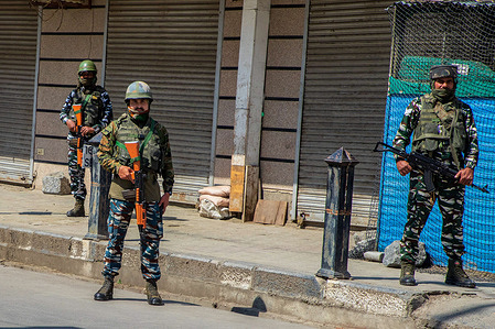 Indian paramilitary troopers stand alert during a shutdown in Srinagar over the derogatory remarks made by two now-sacked India's Hindu nationalist ruling party leaders against Prophet Muhammad (PBUH). Most of the shops and business establishments in Srinagar shut down on Friday. Government forces have been deployed in strength in sensitive places of the city and elsewhere in the valley to maintain law and order, officials said.