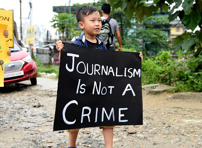 A boy seen holding a placard during the protest.
Media persons marched for their rights and freedom in the northeast Indian city Itanagar, Arunachal Pradesh. Political parties, separatists, insurgents, businesses and government agencies all confirm the increase of violence on media persons in the region.