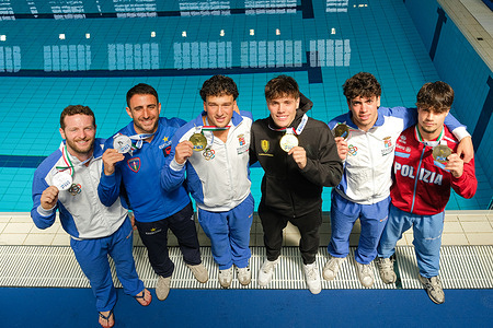 (L to R) Silver medallists Lorenzo Marsaglia and Giovanni Tocci, gold medallists Matteo Santoro and Stefano Belotti and bronze medallists Valerio Mosca and Matteo Cafiero on podium after the Italian Absolute Indoor Open Diving Championships – Men's Synchronized 3m Springboard Final at the Piscina Monumentale.