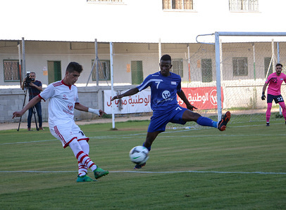 Players from Hilal Jerusalem Club and Khan Younis Youth Club in action.
The final match for the Palestine Cup in the Palestine Stadium in Gaza City between the Youth Club of Khan Younis and Hilal Al Quds Club and the victory was to the Khan Younis Youth Club 3-2
