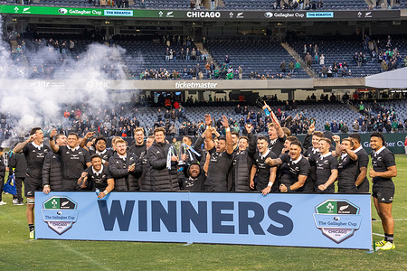 New Zealand players celebrate their victory over Ireland with the Gallagher Cup Trophy presentation after the Ireland vs New Zealand Gallagher Cup Rematch at Soldier Field. Final Score: Ireland 13:26 New Zealand