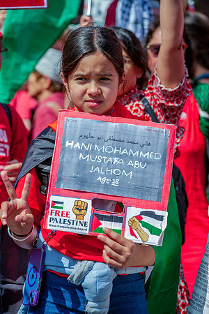 A young girl holds a placard expressing her opinion during "The Red Line" demonstration. Around 150,000 protesters participated in " The Red Line" demonstration in the Hague, which is said to be the largest demonstration in the past 20 years. The demonstrators wore the color red to symbolize the "The Red Line" that should have been drawn by the Schoof cabinet. The demonstrators want the cabinet to take firm action to stop Israel’s continued violation of the law of war. The demonstrators walked from the Malieveld to the Peace Palace, the location of the International Court of Justice (ICJ), where a genocide case against Israel is pending.