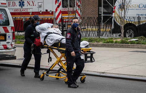 BROOKLYN, UNITED STATES - APRIL 14, 2020: A patient is being brought to Brooklyn hospital by the EMS workers amid the coronavirus outbreak.
As the curve flattens, New York continues to see high daily death tolls, recording once again over 700 coronavirus deaths yesterday.
