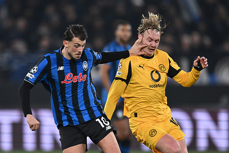 Lazar Samardzic of Atalanta B.C. and Julian Brandt of Borussia Dortmund are in action during the UEFA Champions League 2025/26 League Knockout Play-off Second Leg match between Atalanta B.C. v Borussia Dortmund at the Bergamo Stadium on February 25, 2026 in Bergamo, Italy. Atalanta B.C. 4 - 1 Borussia Dortmund