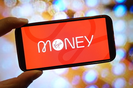 In this photo illustration, a Virgin Money UK company logo is seen displayed on a smartphone screen.