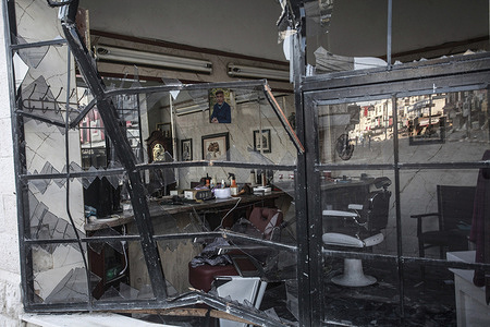 A barbershop destroyed by the Israeli army following a military operation in the Jenin refugee camp in the northern West Bank. A military operation carried out by the Israeli army. The army said the military operation aimed to eliminate Palestinian armed factions, battalions and called it Operation "Iron Walls". Israeli bulldozers destroyed streets, infrastructure and surrounded Palestinian hospitals inside the city of Jenin.
