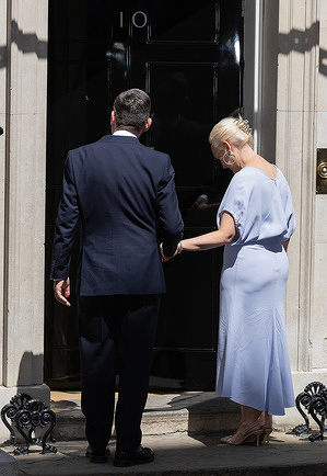 Prime Minister Andy Burnham and his wife Marie France Van Heel seen outside the door of Number 10 in Downing Street, London. As the new Labour leader and leader of the party in government, Burnham was invited by King Charles III to form an administration in his name after Keir Starmer tendered his resignation earlier today.