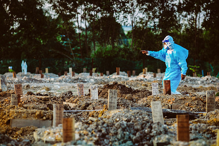 A funeral management worker wearing a Personal Protective Equipment (PPE) seen counting the latest burial pits at the Islamic Cemetery.
Malaysia has recorded the highest number of covid-19 cases with 19,819 new cases and 257 deaths.