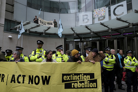 Environmental activists holding a Large banner in front of the BBC building main entrance during the demonstration.
Extinction Rebellion environmental activists gathered outside BBC in London to raise awareness of the ecological and climate crisis and to demand the true coverage of the environmental crisis.