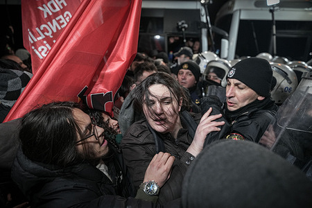 A female protester is caught in the middle as police intervene during the demonstration. In the operation targeting areas occupied by the YPG/SDG, approximately 75% of the organization's territory came under the control of the Syrian army, and following this strategic collapse, pro-organization groups staged a protest in Ankara.