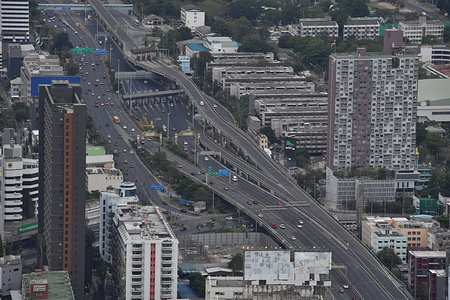 BANGKOK, THAILAND - MAY 7, 2020:
An aerial view from Baiyoke Sky Tower showing complicated ring of expressways and main roads of Bangkok.