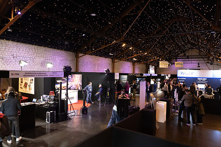 Attendees are seen entering the Dock Eiffel hall during the final day of the SATIS Expo 2025 in Paris. The SATIS Expo 2025 brought together professionals from the audiovisual and media sectors at the Docks de Paris for two days of conferences, exhibitions, and networking centered on innovation, creation, and emotion, closing on November 6, 2025.