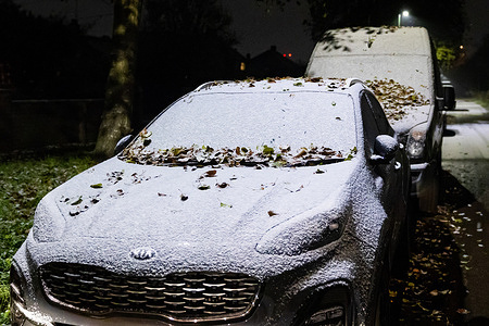 Cars covered in snow are pictured as adverse weather falls in Twickenham. Temperatures in London dropped minus three degrees Celsius last night, and yellow weather warnings for snow, ice, and fog are in place in parts of the United Kingdom.