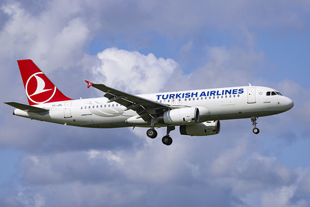 Turkish Airlines Airbus A320-200 seen landing at the Amsterdam Schiphol International Airport in the Netherlands. 
The aircraft is an Airbus A320-232, equipped with two V2500 engines, with registration TC-JPL and airplane name Goreme. Turkish Airlines TK connects Amsterdam AMS / EHAM to Istanbul Atatürk IST / LTBA airport and Istanbul Sabiha Gökçen SAW / LTFJ in Turkey.