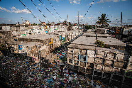 General view of Navotas Cemetery. In the center of Pasay District of Metro Manila is a cemetery where over 10,000 deceased people is resting in peace but there are also over a two hundred of living ones staying at the very same place side by side with the dead. Many families moved to the cemetery due to lack of fund and they find the cemetery the best place to put a roof over their head for free.