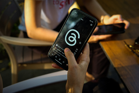 In this photo illustration, a Threads logo is seen displayed on a smartphone. Threads, the new application of Meta and a rival of Twitter gained more than 30 million users on the first day of its launch.