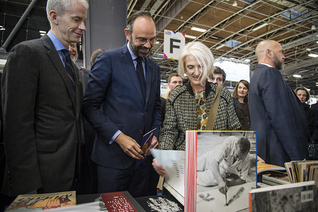 French Prime Minister Edouard Philippe (C) and Franck Riester Minister of Culture (L) are seen visiting the 2019 Paris Book Fair.