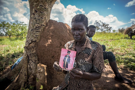 Jeanette Aromorach holds a portrait of her son, Stewart Rubamga-Kwo who died after he was unable to reach the hospital because of the transport ban during the Coronavirus (COVID-19) lockdown crisis.Uganda brought in a ban on private and public transport at the end of March in a bid to curb the spread of coronavirus. Uganda has confirmed 63 coronavirus cases with 45 recovered.