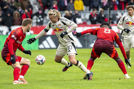 Walker Zimmerman, Emil Forsberg and Jose Cifuentes seen in action during the MLS game between Toronto FC and NY Red Bulls at BMO stadium. Final score; Toronto FC 1:1 NY Red Bulls.