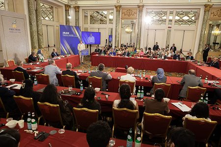 Guy Verhofstadt, former Prime Minister of Belgium addresses the international delegation from the podium. Former heads of state, international diplomats, and senior officials gathered for the international conference "Iran – Beyond War – Human Rights and the Power of the People as the Solution". Keynote speaker Maryam Rajavi, President-elect of the National Council of Resistance of Iran (NCRI), alongside European leaders, asserted that neither foreign military intervention nor appeasement can solve the Iranian impasse. The assembly reached a consensus that true regime change must be enacted from the bottom up by the Iranian people and their organized resistance, endorsing Maryam Rajavi's Ten-Point Plan to establish a secular, democratic republic.