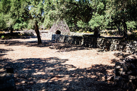 A view of the prehistoric ruins and archaeological remains of the Bruncu Madugui Nuraghe located on the edge of the volcanic basalt plateau of Giara di Gesturi.