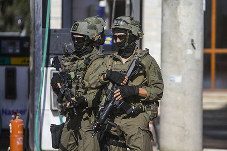 Israeli solders take positions during search operation for the perpetrator of the shooting attack on a Jewish settler near Hermish settlement. The Israeli army forces are conducting an intense search for the perpetrator of the shooting attack on a Jewish settler at the gate of Hermish settlement, which led to his death.