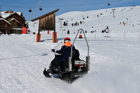 A man seen on a snowmobile in the Alpe d'Huez ski resort.