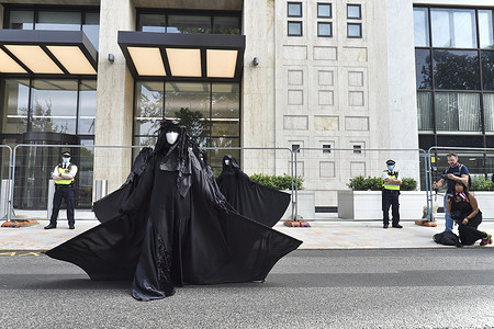 Members of the Black Brigade seen during the performance.
Extinction Rebellion ‘Black Brigade ‘ perform outside Shell Tower in Waterloo, trying to step up the pressure on the fossil fuel giant to end destruction of ecosystems and communities around the world.