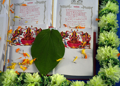 Chopda (books of accounts) are kept for performing rituals on the occasion of Chopda poojan inside Swaminarayan temple at Dadar in Mumbai.
Chopda (books of accounts) poojan rituals were performed inside the temple premises and devotees watched the same online as there were restriction on gathering of people due to coronavirus pandemic.