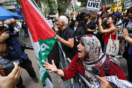 A Palestinian protestor confronts zionist counter-protesters during a demonstration in support of Palestine in Midtown Manhattan. In New York City, thousands of protesters marched from Time Square to the United Nations headquarters to denounce Benjamin Netanyahu’s war crimes while he was speaking at the U.N.