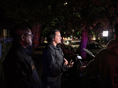 Seattle Police Detective Eric Munoz speaks to members of the media outside UW’s Nordheim Court apartment complex as investigators continue processing the scene of a possible homicide inside the Nordheim Court 7 laundry room late Wednesday night. Seattle Police Department and University of Washington Police Department are investigating a possible homicide Wednesday night at Nordheim Court. Police responded around 10:11 p.m. to reports of a deadly incident inside the Nordheim Court 7 laundry room. Investigators believe the victim was a 19-year-old transgender individual transitioning from male to female.

Detective Eric Munoz said investigators are reviewing surveillance footage from the apartment complex and nearby areas to track the suspect’s movements.
Authorities describe the suspect as a Black male. Police believe he fled the scene on foot shortly after the homicide. The victim’s identity has not been officially released. The investigation remains ongoing, and anyone with information or surveillance footage is urged to contact Seattle Police or UWPD.