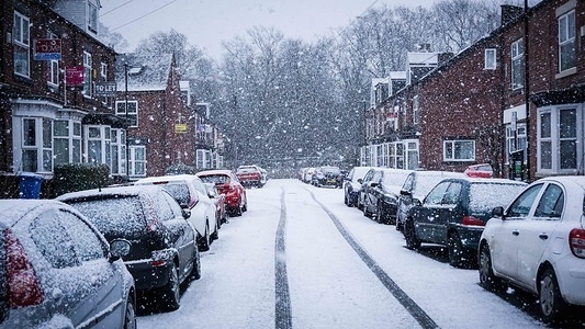 Vehicles seen parked during snowfall in Sheffield city center. Cold Spell hits the Britain with snow and low temperatures.