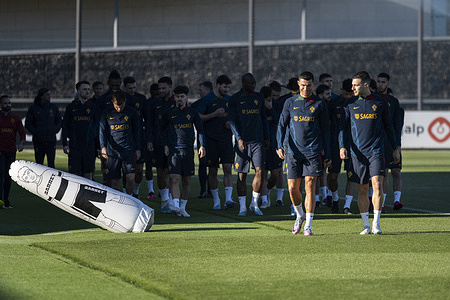 Cristiano Ronaldo (L) and Diogo Dalot (R) seen ahead of Portugal team players during the training session at Cidade do Futebol training ground in Oeiras. Portugal football team trains ahead of the Euro 2024 qualifying matches against Liechtenstein and Luxembourg.
