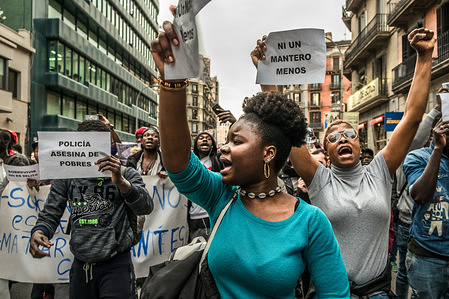 Two black women in front of the demonstration of street vendors in memory of Mame Mbaye. Hundreds of people, mostly black, protested in Barcelona by the death of Mame Mbaye, street vendor in Madrid who lost his life after the harassment by the municipal police of Madrid.