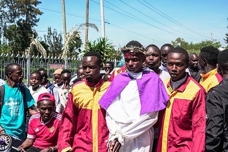 Catholic faithful take part in the Way of the Cross during he Good Friday celebrations, commemorating the crucifixion and death of Jesus Christ at Calvary, a solemn day marked by fasting, reflection and mourning among Christians.