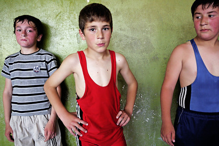 Young wrestlers seen at a local gym.
When two wrestle together, their sweat mix and they become brothers forever... 
Nugzar Skhireli (65) has a lot of brothers. With a title „merited trainee of Georgia“ he trains children and young wrestlers of traditional Georgian wrestling called Tavisupali. The gym in the town of Gori with mildewy walls has only poor facilities. Barbells are made from an old bus stop and showers with toilets are dark and stinky. Weighing machine is the most modern part of equipment... Even though champions grow here: sportsmen from Gori are successful in both national and international competitions.