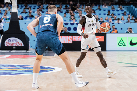 Dennis Schroder (R) of Germany and Edo Muric (L) of Slovenia seen in action during the final phase of the FIBA EuroBasket 2025 between Slovenia and Germany at Arena Riga. Final score Germany 99 : 91 Slovenia.