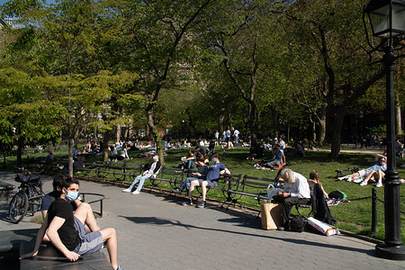 New Yorkers flock to Washington Square Park on a sunny day amid the coronavirus pandemic.