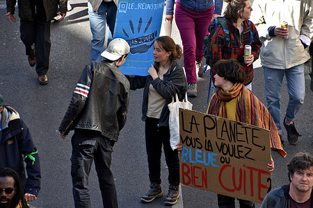 Protesters hold placards during the demonstration. On the eve of the first round of the presidential election, demonstrations are organized throughout France to make the next five years those of social justice, ecology and real equality for discriminated minorities.