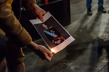A protester seen burning a photo of the King of Spain Felipe VI during a protest called by the Republic Defence Commitees (CDR) with the slogans 'Bourbon and Constitution to the bonfire!' to reaffirm the independence of Catalonia and the Catalan Republic.