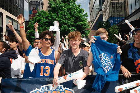 Fans of the New York Knicks holding memorabilia during the Madison Square Garden outdoor watch party in New York City during the NBA Eastern Conference game against the Philadelphia 76ers.