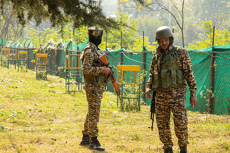 Indian paramilitary soldiers stand on alert near the venue where Omar Abdullah takes oath as a Chief Minister of Jammu and Kashmir during the swearing-in ceremony at Sher-i-Kashmir International Conference (SKICC), in Srinagar. Jammu and Kashmir National Conference (JKNC) party Vice President takes oath as the first Chief Minister of Jammu and Kashmir since it became a Union Territory, following his National Conference party's victory in the Himalayan troubled region's first local Assembly election since New Delhi stripped the Article 370, the regions special semi-autonomous status and brought it under direct rule.