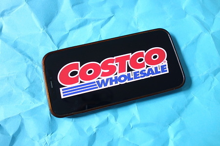 In this photo illustration, the Costco Wholesale Corporation logo is seen displayed on a smartphone screen.