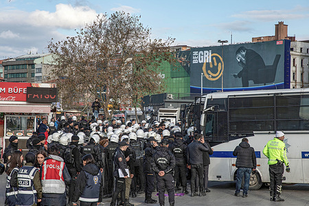 Police officers surround demonstrators in front of the Kadikoy city lines ferry port as they make transfers to the detention vehicle during a demonstration for the Elimination of Violence against Women The police intervened and some demonstrators were detained for taking part in an unauthorised protest on the occasion of the 25 November International Day for the Elimination of Violence against Women, at the Kadikoy pier, Istanbul.